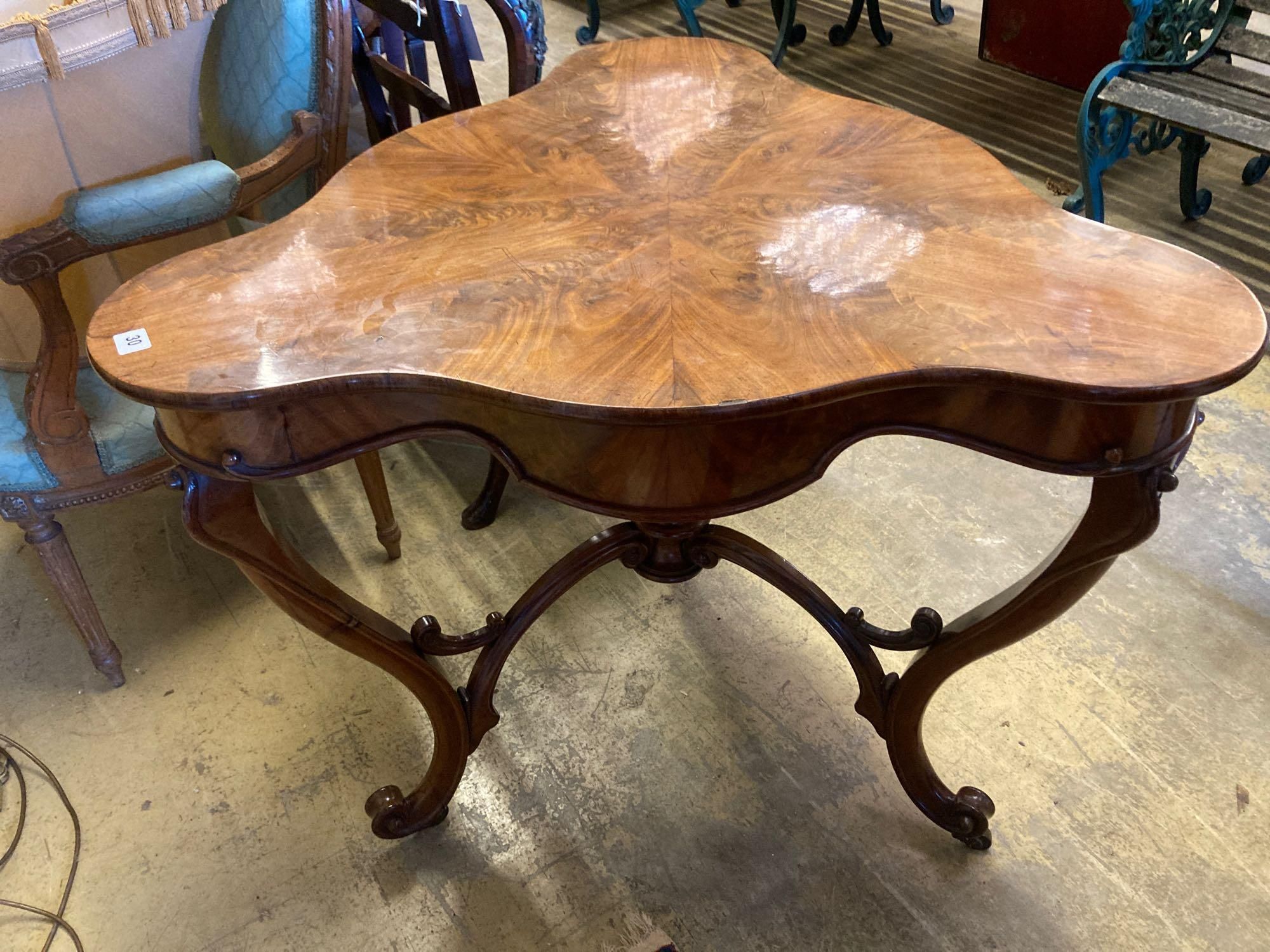 A Continental mahogany trefoil corner table, width 88cm